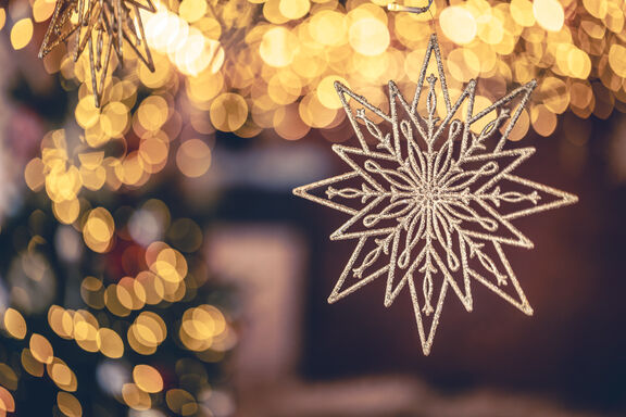 Christmas background with decorative star with bokeh lights